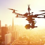 Silhouette drone Flying over San-Francisco city on blurred background