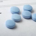 pills on an rx prescription pad